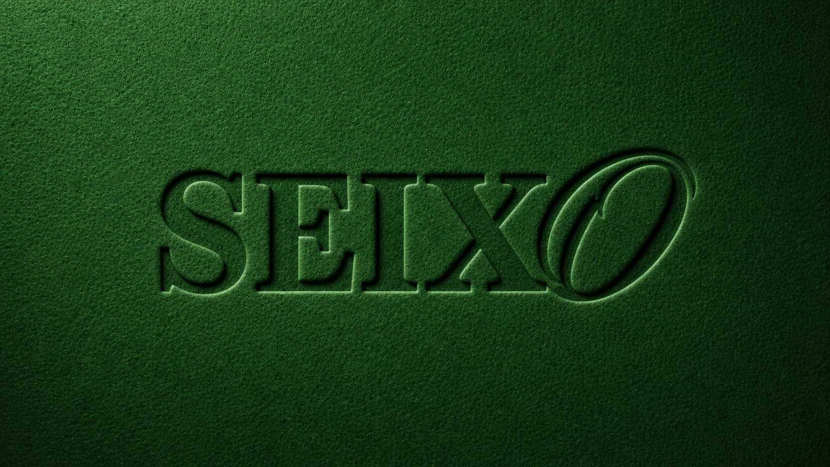 Textura verde tátil com a palavra SEIXO em baixo-relevo
